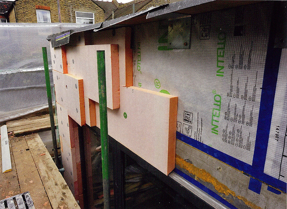 Wall build-up showing Intello airtightness membrane, which was used in places to ensure airtightness, followed outside by a Wetherby external insulation system