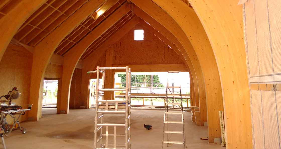 The building’s glulam arch frame provides a striking architectural feature.
