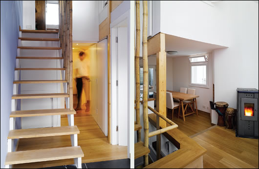  The ground floor hallway (left) with stairs leading to the main living area on the first floor. Bannisters are made from reclaimed bamboo; the main bedroom (right) is located in the converted attic