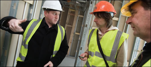 Diarmuid Hynes (left) and David Heffernan, founder of HAA (right) explaining the intricacies of the building to Construct Ireland's John Hearne (centre)