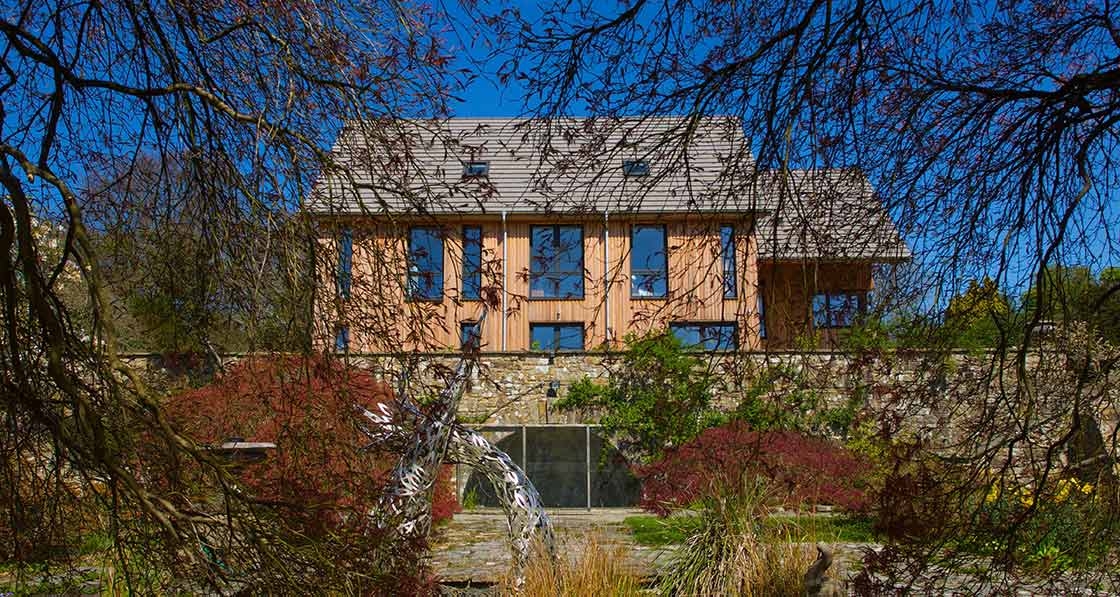 Larch-clad passive house inspired by a venn diagram.