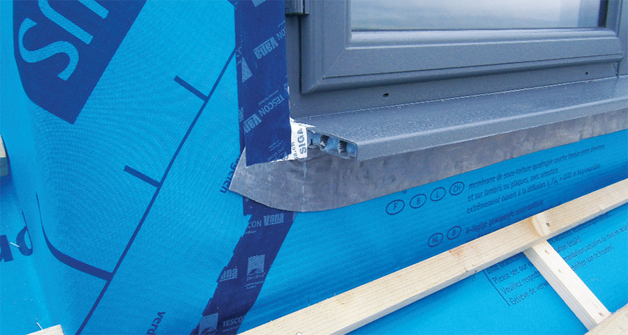 Wind-tightness detailing around windows and the insulated window cills