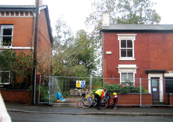 The front of the original house and hardstanding where the new extension is built