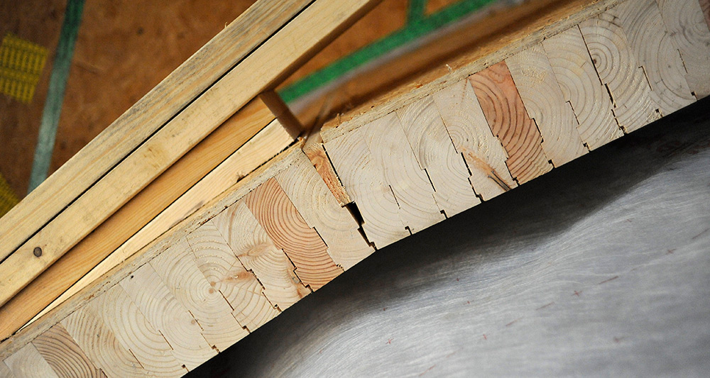 The brettstapel system, an ecological method of solid-timber construction that utilises low grade timber held together with hardwood dowels, was used to form the curved walls of the Pod building, which will house the school’s performance and recreational spaces. The brettstapel system was manufactured in Ireland by Cygnum, using Welsh softwood.