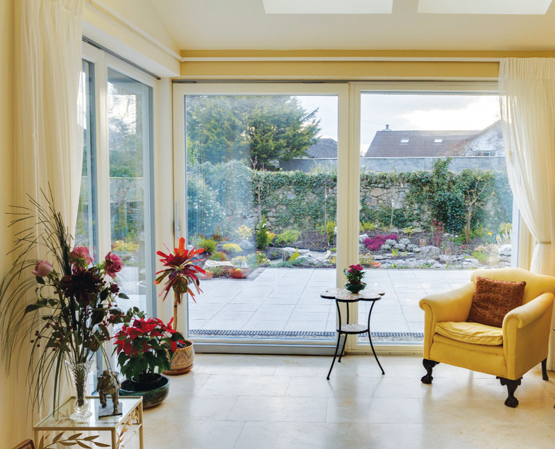 The house was designed to track the sun, with large glazed expanses to the south west facing rear of the property