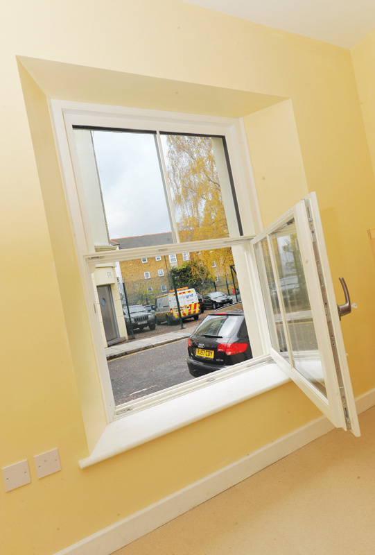 The team designed a triple-glazed, airtight imitation sash window with a fixed top pane and tilt-and-turn lower pane, along with custom made triple-glazed doors