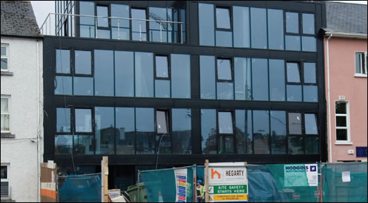 The new development at Forster Street is wedged between two buildings, a challenge which resulted in a design that makes the most of natural light where available