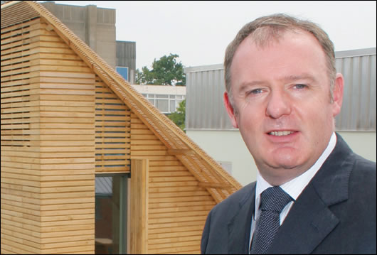 Gerry McCaughey on the BRE site with the Lighthouse in the background