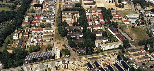 Roof mounted solar panels on the eco-buildings at Vauban, Freinburg. Note the eco homes are oriented towards the sun, whilst many of the conventional buildings are facing east or west