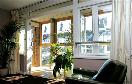 The entire south facing aspect of the BedZED apartments uses winter gardens to let light and heat in