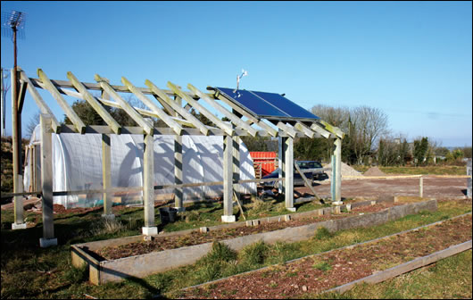 A Sonnenkraft solar array sits on top of a gazebo in the garden so as not to impact on the aesthetics of the house