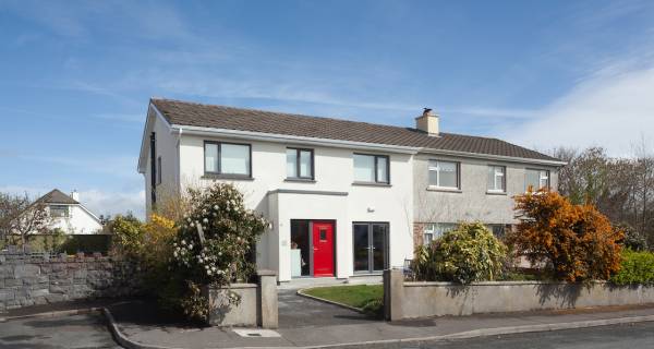 Semi-detached house in Salthill, Galway retrofitted to the passive house standard (at left), with unrenovated dwelling to the right.